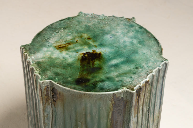 Transform your space with this ceramic piece featuring a layered aqua glaze surface adorned with golden brown sepia accents - EBFKCE