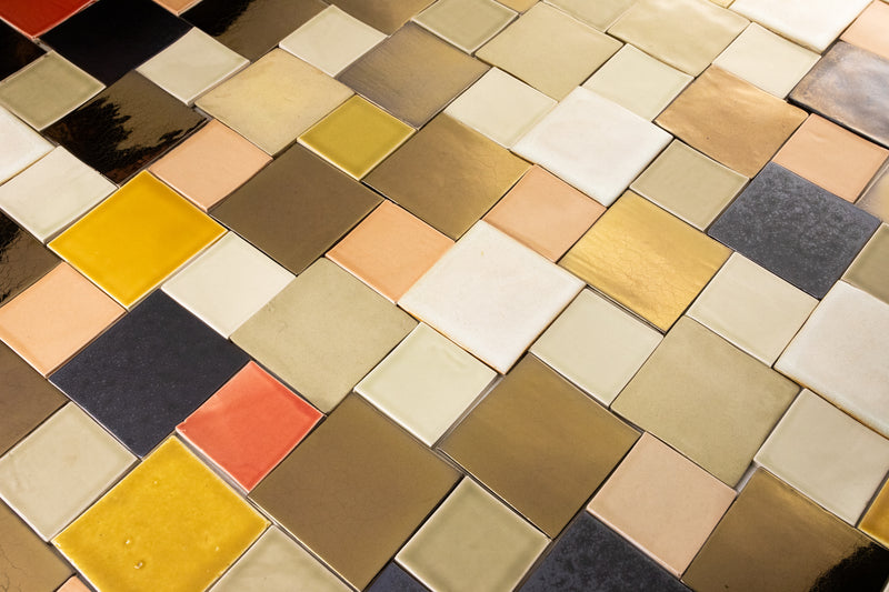 Colourful blend of warm colours and bronze square tiles NTEWUK