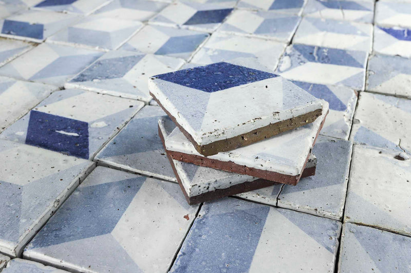 Detail chunky tile with matt glaze and blue pattern
